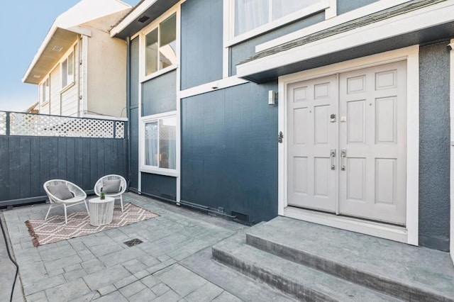 entrance to property with a patio area