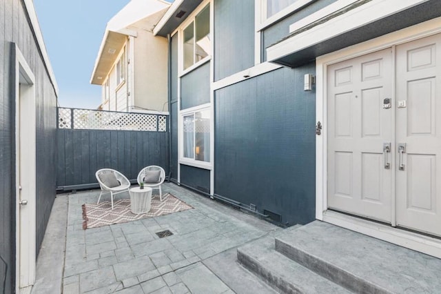 entrance to property with a patio