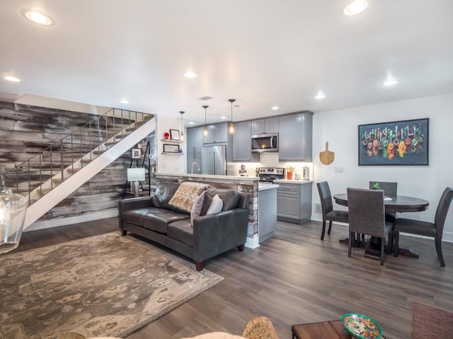 living room with dark hardwood / wood-style flooring