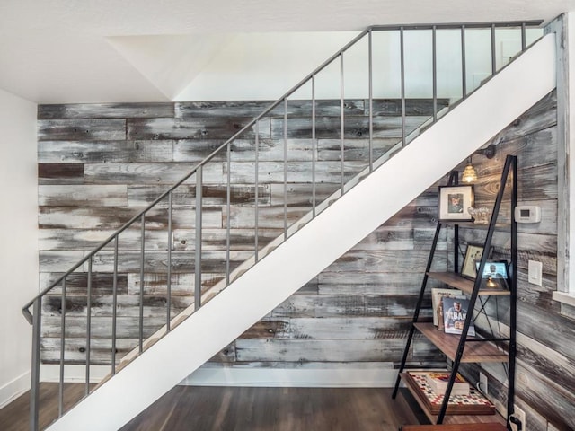 staircase with hardwood / wood-style floors