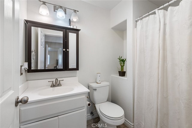 bathroom with toilet and vanity