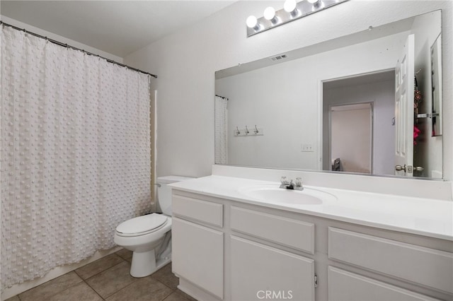 full bathroom featuring tile patterned floors, vanity, shower / tub combo, and toilet