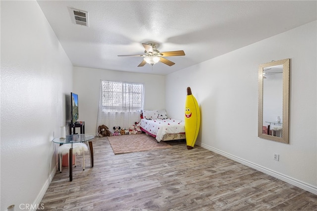 bedroom featuring ceiling fan and wood-type flooring