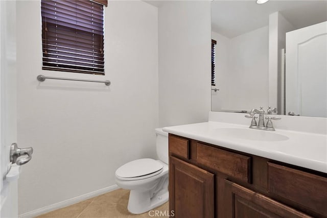 bathroom featuring toilet, vanity, and tile patterned floors