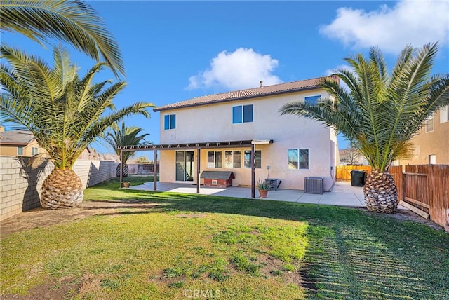 rear view of house featuring a patio area, central AC unit, a lawn, and a jacuzzi