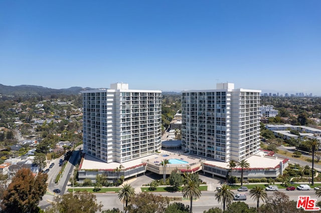 birds eye view of property with a mountain view