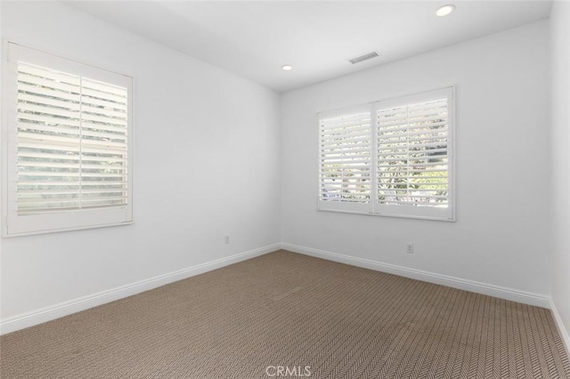 empty room with carpet flooring