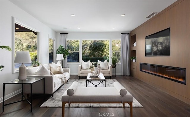 living room with dark hardwood / wood-style flooring