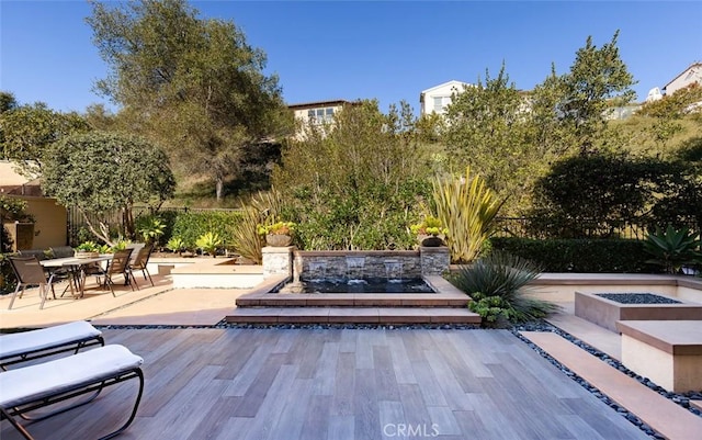 view of patio / terrace with an outdoor fire pit