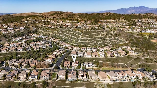 drone / aerial view featuring a mountain view