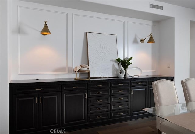 bar featuring dark hardwood / wood-style floors