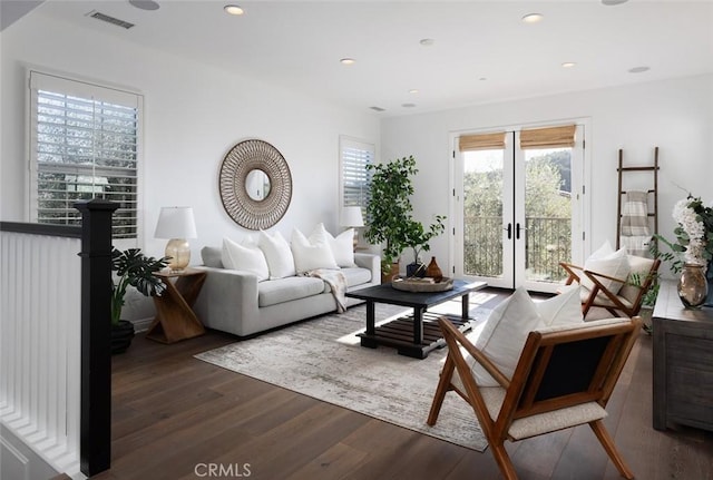 living room with french doors and dark hardwood / wood-style floors