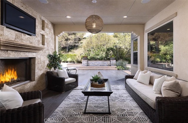 view of patio / terrace featuring an outdoor living space with a fireplace