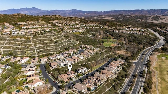 birds eye view of property with a mountain view