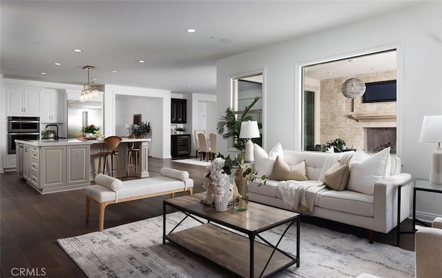 living room with dark hardwood / wood-style flooring