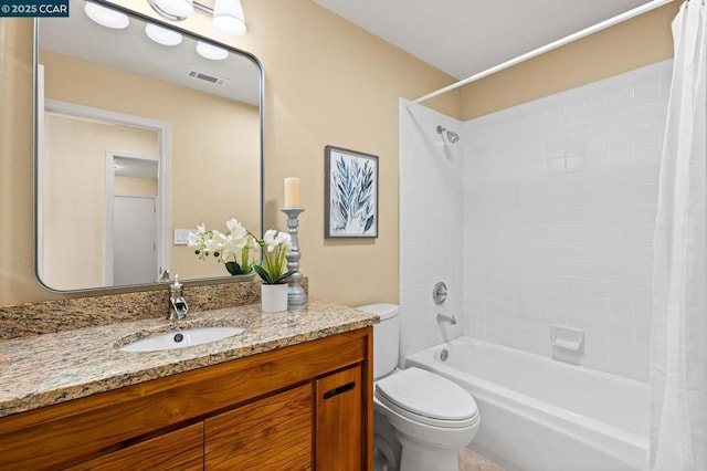 full bathroom with shower / tub combo with curtain, vanity, and toilet