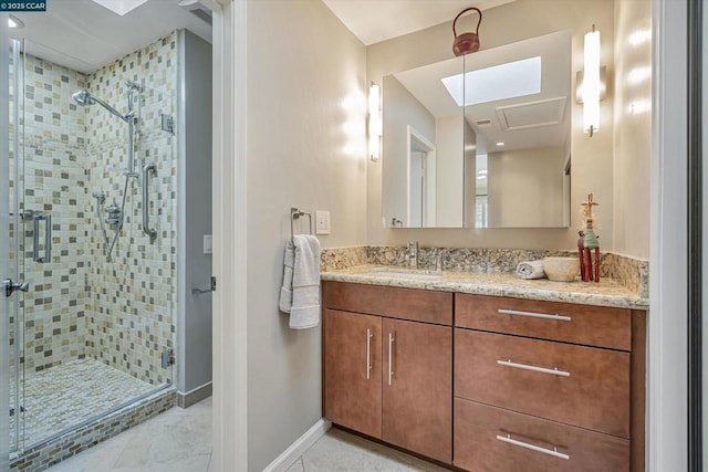 bathroom with a shower with door and vanity