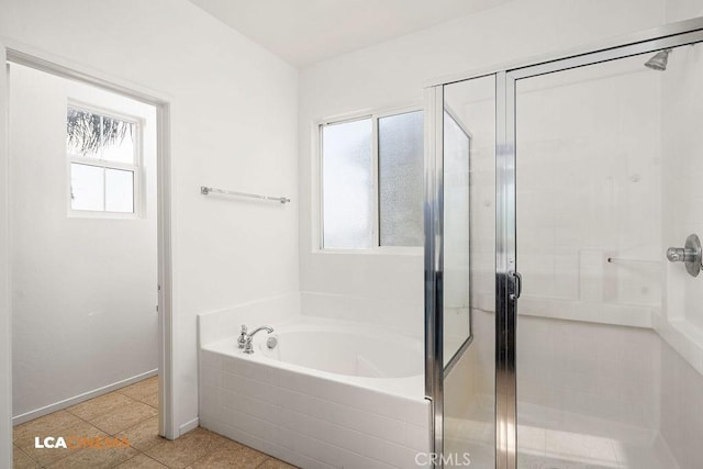 bathroom featuring tile patterned flooring and plus walk in shower