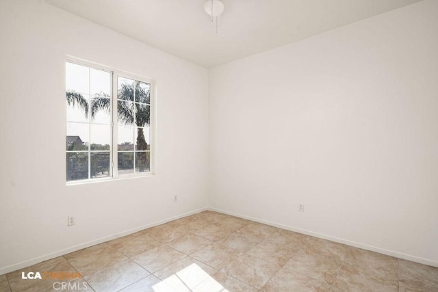 spare room with light tile patterned flooring