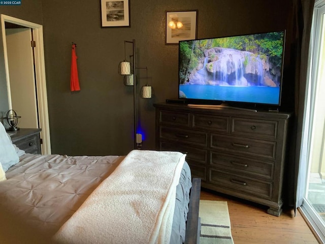 bedroom with light hardwood / wood-style floors