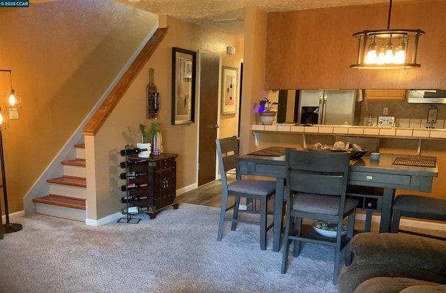 dining room featuring light colored carpet