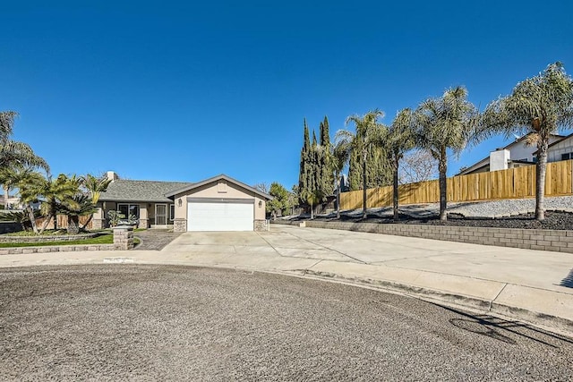 single story home featuring a garage