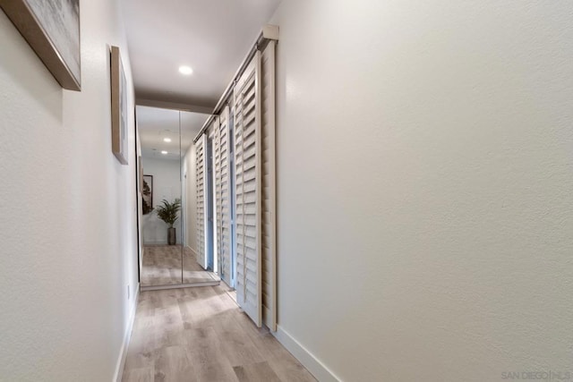 corridor featuring light hardwood / wood-style flooring