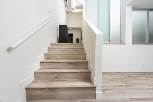 staircase featuring hardwood / wood-style floors