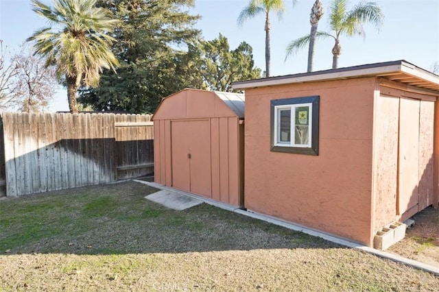 view of outbuilding with a yard