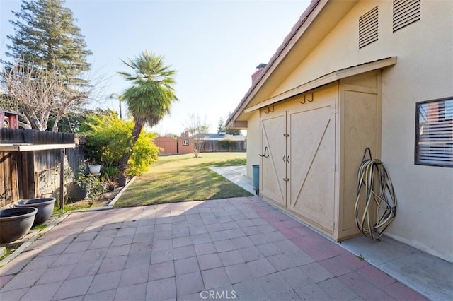 view of patio / terrace with a storage unit