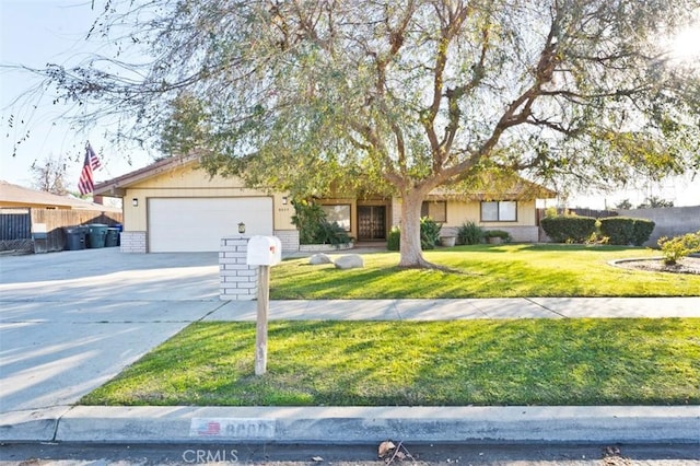 view of front of property with a garage and a front yard