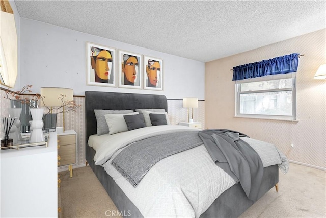 carpeted bedroom featuring a textured ceiling