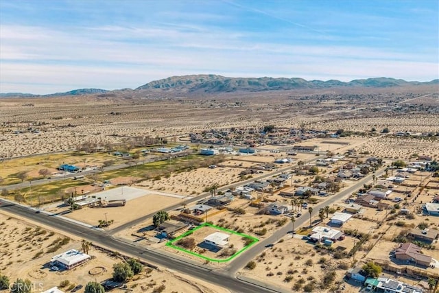 birds eye view of property featuring a mountain view