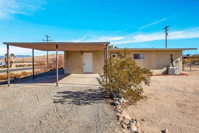 rear view of property featuring a mountain view