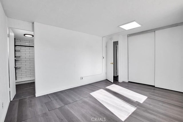 unfurnished bedroom featuring ensuite bath and a closet