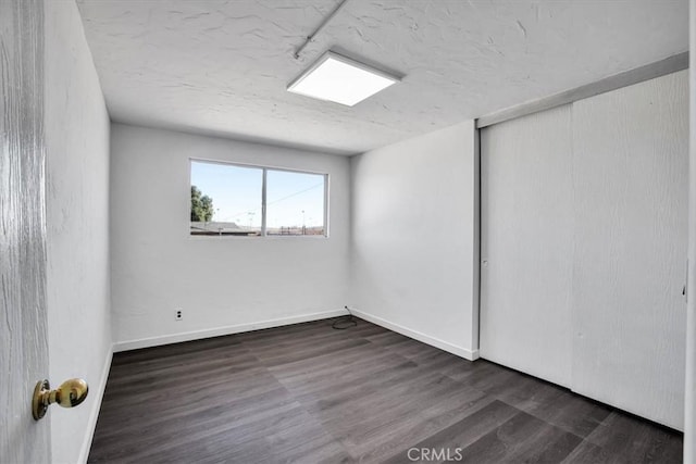 spare room featuring dark hardwood / wood-style floors