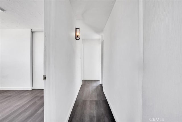 corridor featuring wood-type flooring