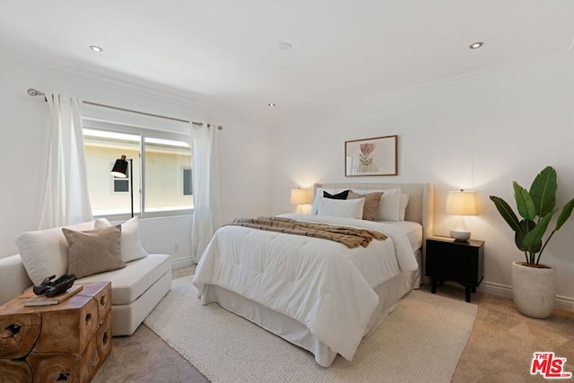 carpeted bedroom featuring crown molding