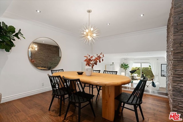 dining area with an inviting chandelier, ornamental molding, and dark hardwood / wood-style floors