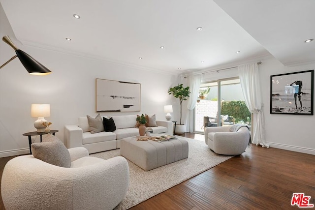 living room with hardwood / wood-style flooring and crown molding