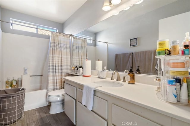 full bathroom featuring toilet, vanity, shower / bath combo, and hardwood / wood-style flooring