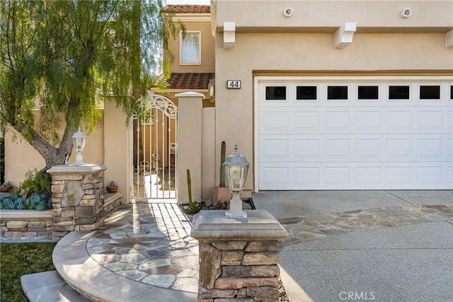 doorway to property featuring a garage