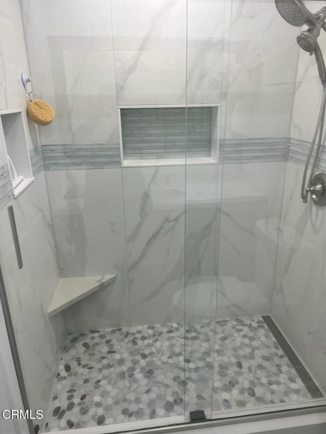 bathroom featuring an enclosed shower