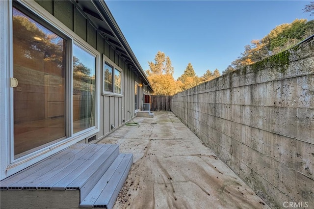 view of property exterior featuring central air condition unit and a patio area