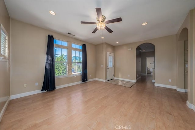 10401 Point Lakeview Rd, Kelseyville, CA 95451 - unfurnished room with arched walkways, a ceiling fan, light wood-style flooring, and baseboards