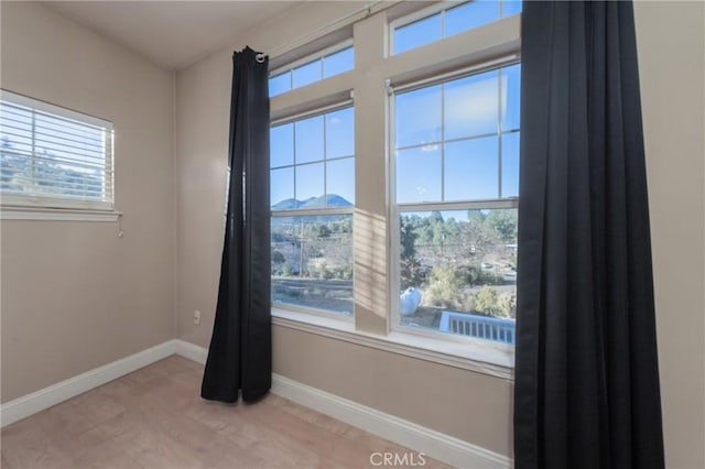 10401 Point Lakeview Rd, Kelseyville, CA 95451 - spare room with baseboards and a mountain view