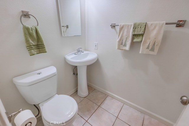 bathroom featuring toilet and tile patterned floors