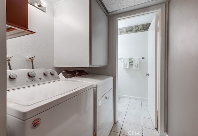 washroom featuring washer and dryer and light tile patterned floors