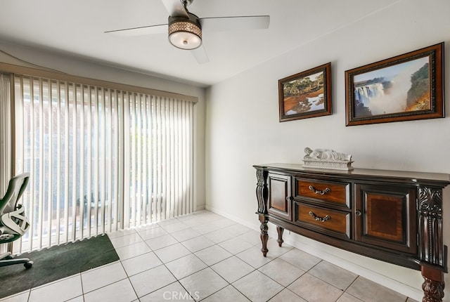 misc room featuring ceiling fan and light tile patterned floors