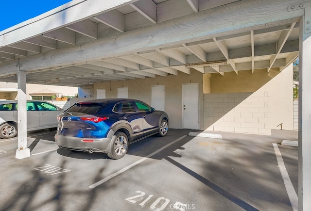 view of vehicle parking with a carport